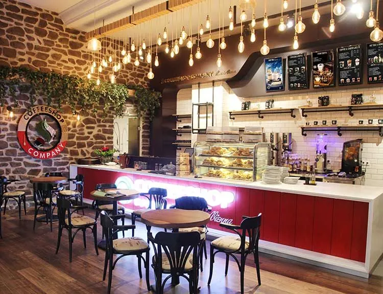 Coffee shop counter with string lights overhead